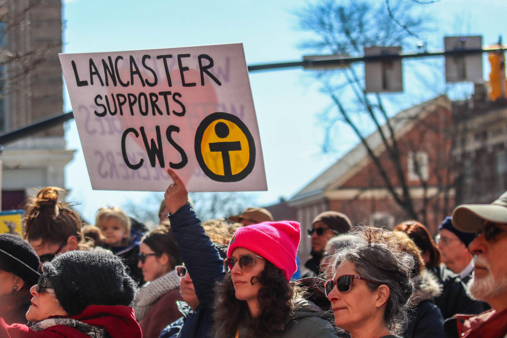 ‘A moral travesty’: Hundreds rally in Penn Square Sunday in support of Church World Service